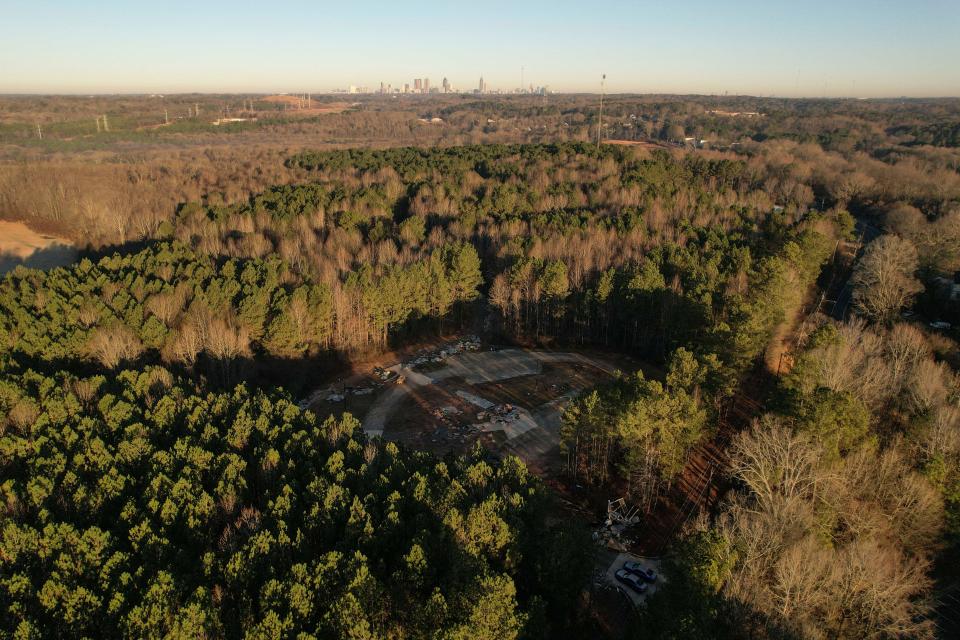 Law enforcement vehicles block the entrance to the site of a the police training facility known as Cop City, near Atlanta