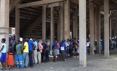 Mourners queue to pay their last respects to Former Zimbabwean president Robert Mugabe as he lies in state at the at Rufaro stadium