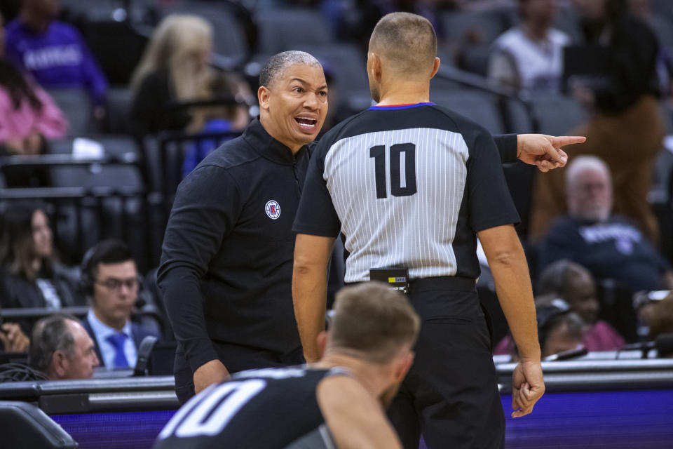 Los Angeles Clippers coach Tyronn Lue argues with official John Goble (10) during the second half of the team's NBA basketball game against the Sacramento Kings in Sacramento, Calif., Saturday, Oct. 22, 2022. The Clippers won 111-109. (AP Photo/Randall Benton)