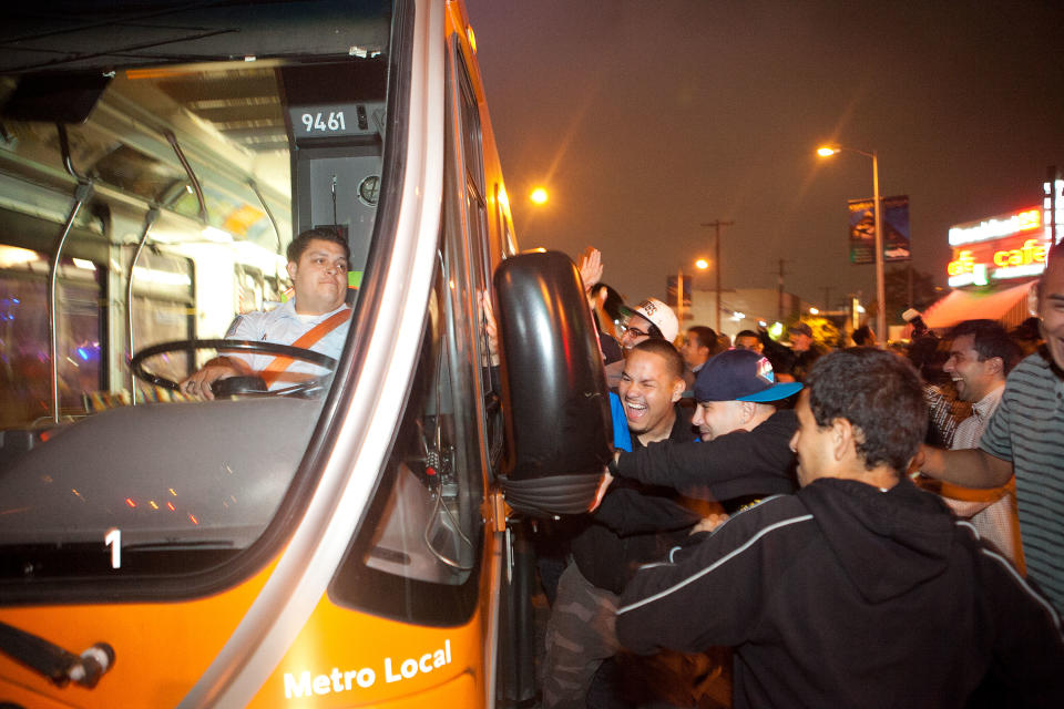 LOS ANGELES, CA - JUNE 11: A group of fans attack a city bus after the Los Angeles Kings defeated the New Jersey Devils to win the 2012 Stanley Cup Final June 11, 2012 in Los Angeles, California. The win is the Los Angeles Kings first championship in franchise history. (Photo by Jonathan Gibby/Getty Images)