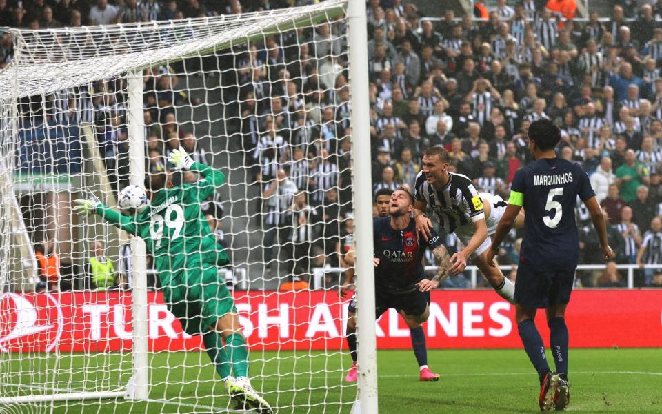 Newcastle United's Dan Burn scores their second goal past Paris St Germain's Gianluigi Donnarumma