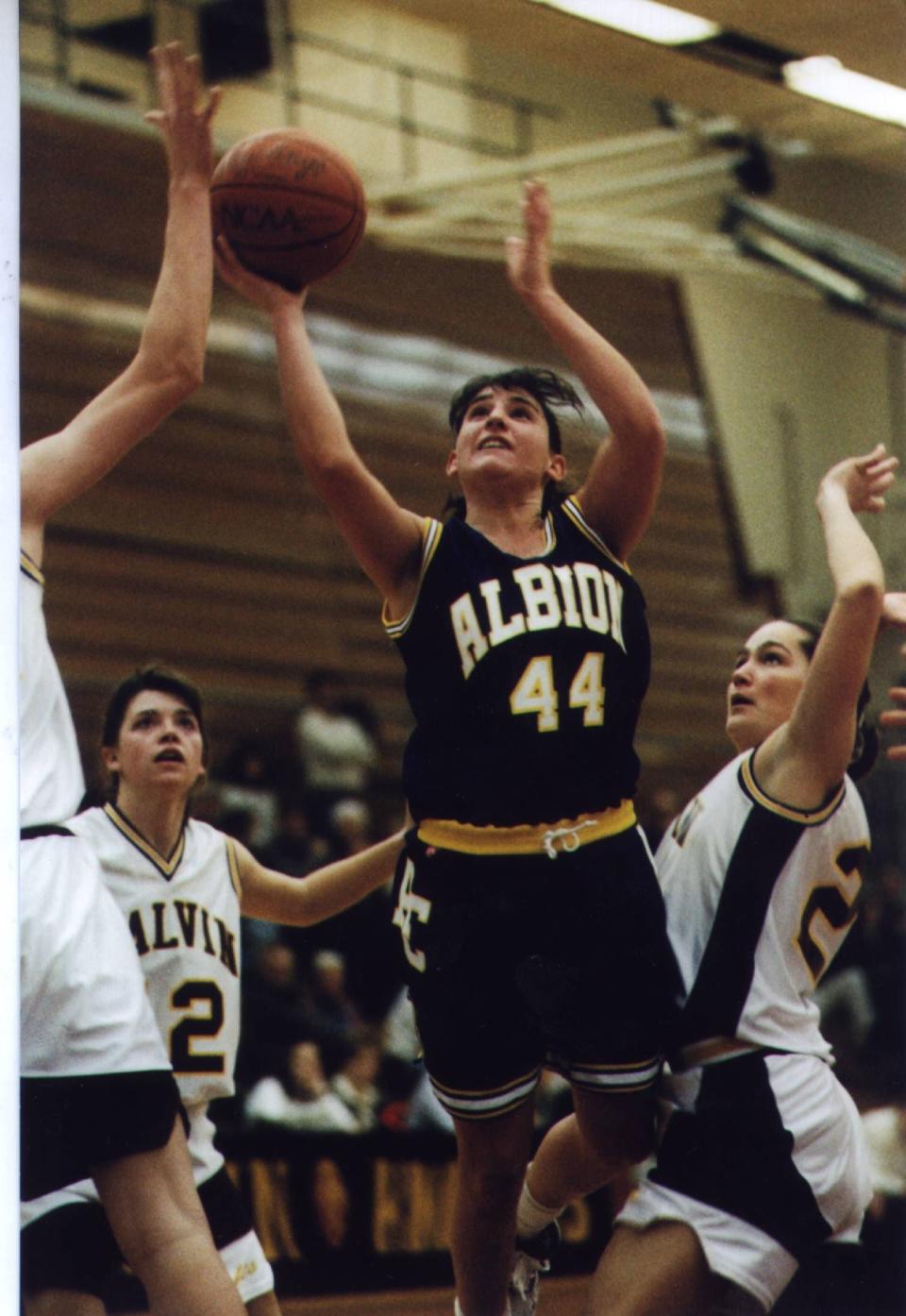 Christie Cleland Hursey shoots during a contest in 1996 for Albion College. Hursey will be inducted into the Greater Lansing Sports Hall of Fame on Aug. 10.