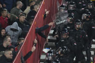 Riot policemen arrive to secure the area during the Euro 2024 group G qualifying soccer match between Serbia and Montenegro, at the Rajko Mitic Stadium in Belgrade, Serbia, Tuesday, Oct. 17, 2023. (AP Photo/Darko Vojinovic)