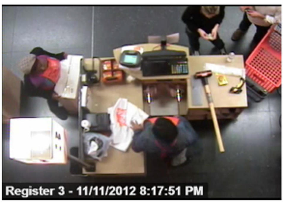Surveillance video of Dr. Pamela Buchbinder and Jake Nolan, upper right, at a New York City Home Depot on Nov. 11, 2012. / Credit: Manhattan D.A.'s Office