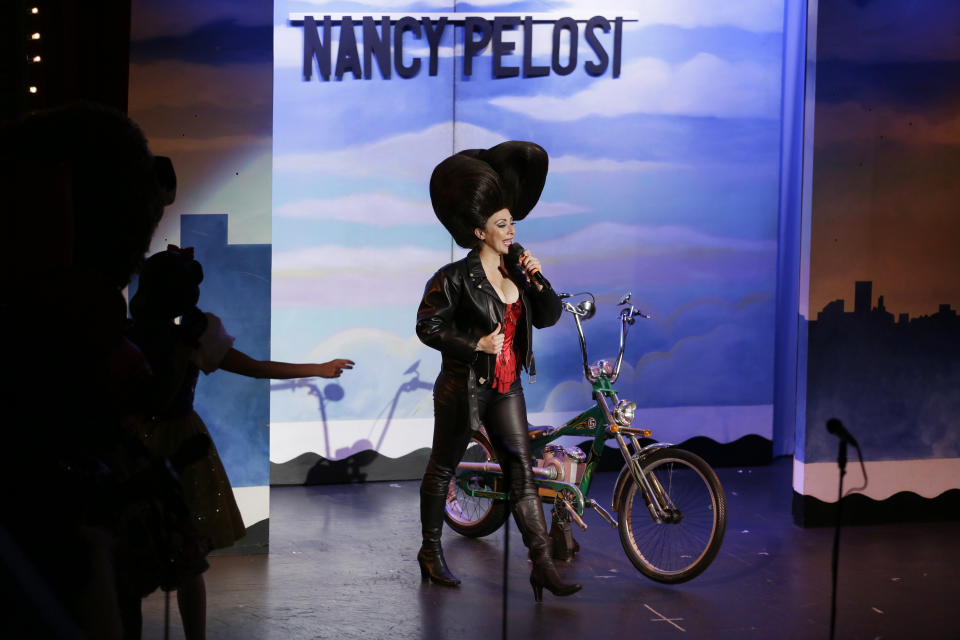 In this Wednesday, Dec. 4, 2019 photo, Speaker of the House Nancy Pelosi is portrayed by Jacqui Heck during a performance of the musical "Beach Blanket Babylon" in San Francisco. The campy small San Francisco show that's been a must-see for tourists and locals alike for more than 45 years, making it the nation's longest continuously running musical revue, is closing its curtain. Its final performance is set for New Year’s Eve. (AP Photo/Eric Risberg)