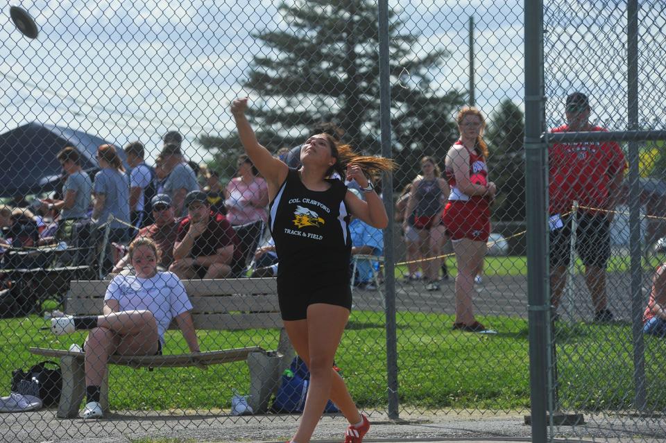 Colonel Crawford's Corin Feik launches the discus at the Northern 10 meet.