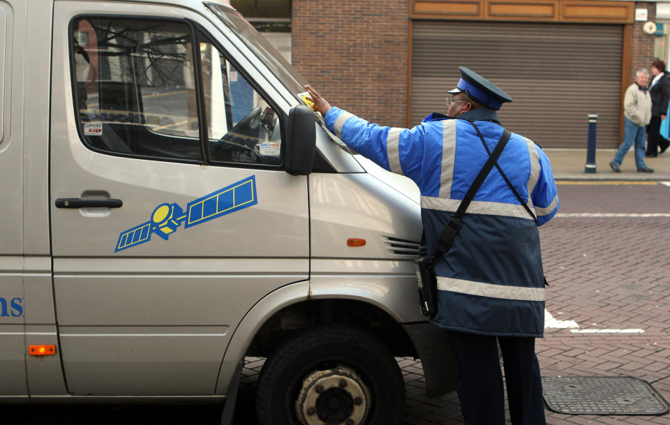 You can’t park there! A warden issues a ticket in Solihull (PA)