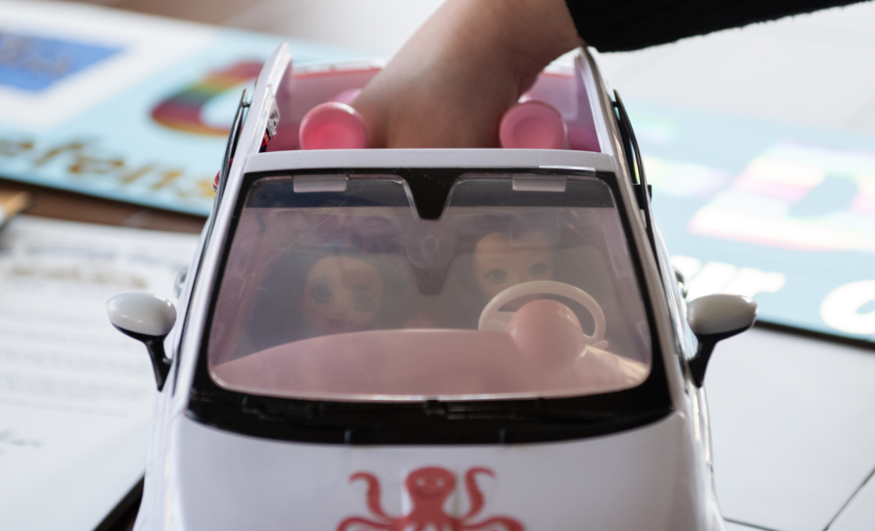 Ava-Elizabeth Bell, at her home in Rootstown, demonstrates the mechanics of her OCT-D Defense For Your Car invention. The windshield is currently clear.