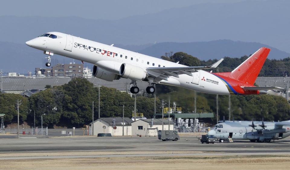 A SpaceJet, formerly known as MRJ, takes off during a test flight at an airport in Nagoya, central Japan, on March 18, 2020. Japanese manufacturer Mitsubishi Heavy Industries is slashing spending for its repeatedly delayed regional jet, amid economic damage from the coronavirus pandemic.(Yuya Shino/Kyodo News via AP)