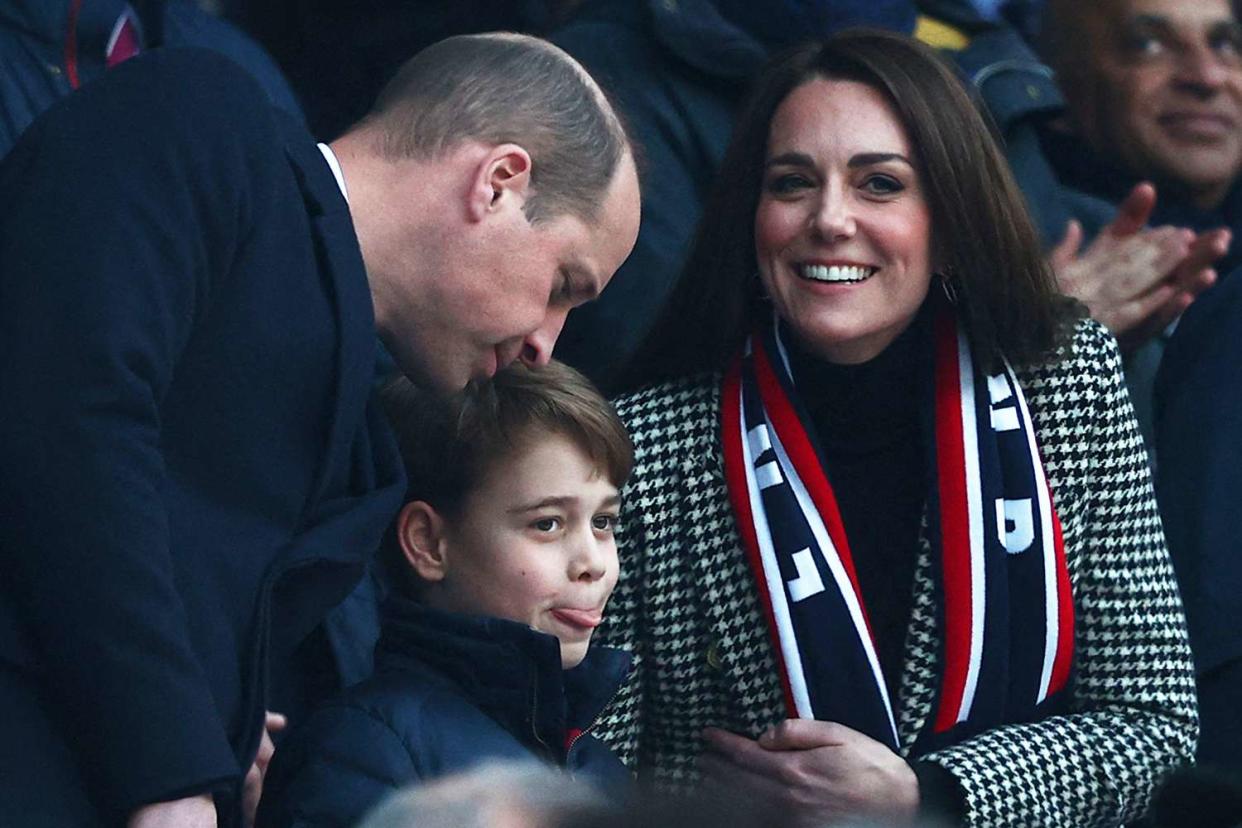 Britain's Prince William, Duke of Cambridge, (L), Britain's Prince George of Cambridge (C) and Britain's Catherine, Duchess of Cambridge, (R) attend the Six Nations international rugby union match between England and Wales at Twickenham Stadium, west London, on February 26, 2022.