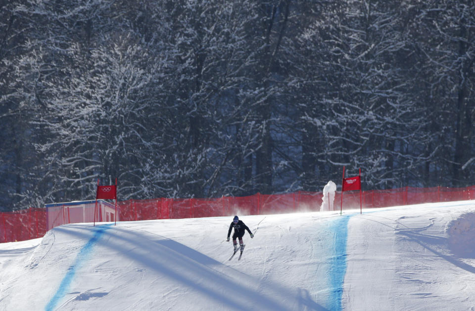 A skier speeds clears the final jump during training ahead of the Sochi 2014 Winter Olympics, Wednesday, Feb. 5, 2014, in Krasnaya Polyana, Russia. (AP Photo/Christophe Ena)