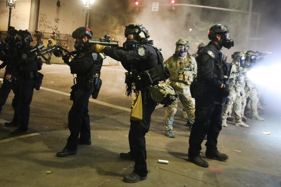 Federal police face off with protesters in front of the Mark O. Hatfield federal courthouse