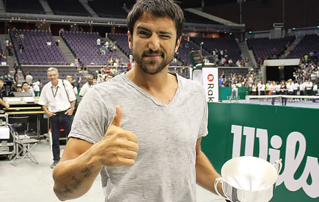 Janko Tipsarevic from Europe flashes a thumbs-up after winning the tournament. (Yahoo! photo/Melissa Law)