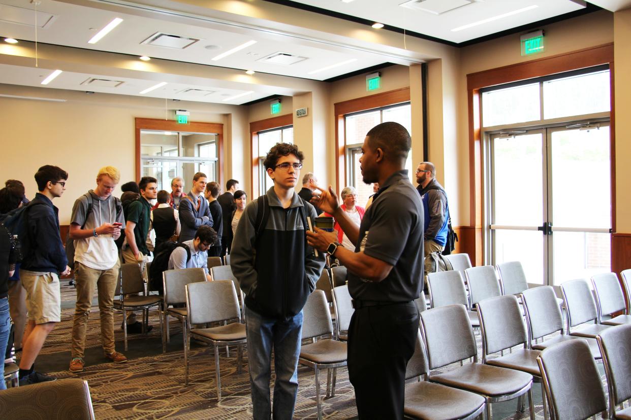 Marcus Magee interacts with a student from Columbia State Community College.