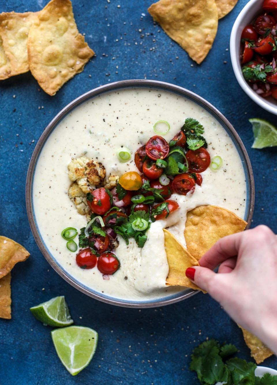 <strong><a href="https://www.howsweeteats.com/2019/02/cauliflower-queso/" target="_blank" rel="noopener noreferrer">Get the Roasted Cauliflower Queso recipe from How Sweet Eats</a></strong>