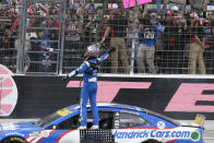 Kyle Larson (5) celebrates after winning a NASCAR Cup Series auto race at Texas Motor Speedway Sunday, Oct. 17, 2021, in Fort Worth, Texas. (AP Photo/Randy Holt)