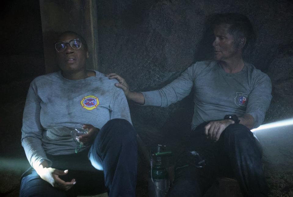 "9-1-1" paramedic Hen (Aisha Hinds), left, and "9-1-1: Lone Star" firefighter Owen get personal while sheltering in a mine during Monday's wildfire crossover episode of Fox's "Lone Star."