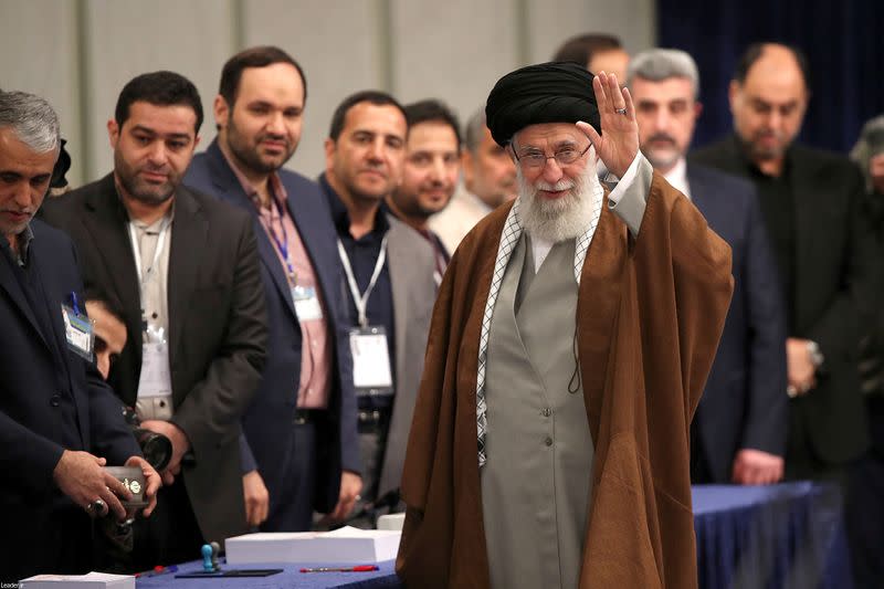 Iran's Supreme Leader Ayatollah Ali Khamenei arrives to cast his vote at a polling station during parliamentary elections in Tehran
