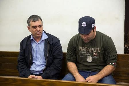 Shlomo Filber (L) sits at the Magistrate Court during his remand in Tel Aviv, Israel, February 18, 2018. REUTERS/Stringer