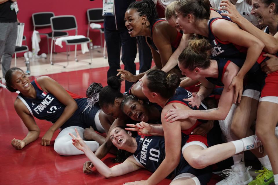 France players celebrate after their win over Serbia in a women's basketball bronze medal game at the 2020 Summer Olympics, Saturday, Aug. 7, 2021, in Saitama, Japan. (AP Photo/Eric Gay)