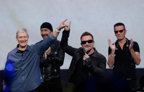 Tim Cook with U2