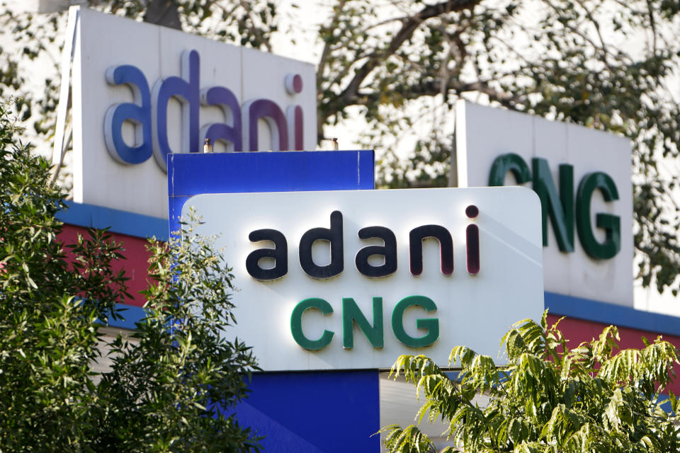 Signage of Adani's compressed natural gas station are displayed at company's outlet in Ahmedabad, India, Feb. 2, 2023. Losses for the troubled Adani Group, India's second-largest conglomerate, deepened on Friday as shares in its flagship company tumbled another 25%, extending over a week of declines that have wiped out tens of billions of dollars in market value. (AP Photo/Ajit Solanki)