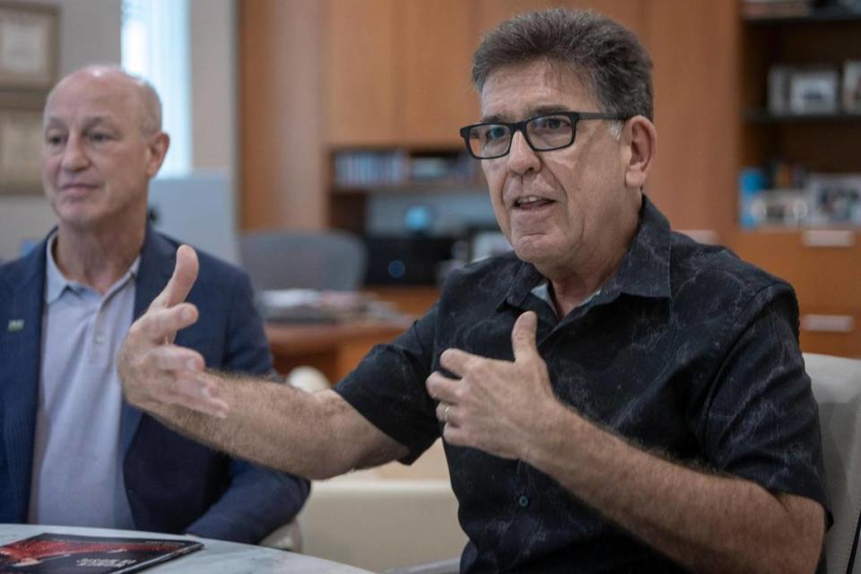 Rey Sanchez, right, Associate Dean for Strategic Initiatives and Innovation at the Frost School of Music, answers questions during an interview as Shelton Berg, left, Dean of the Frost School of Music listens.