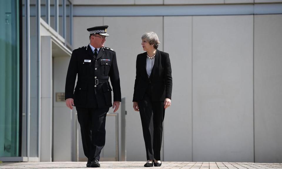 Theresa May talks with Chief Constable of Greater Manchester Police Ian Hopkins.