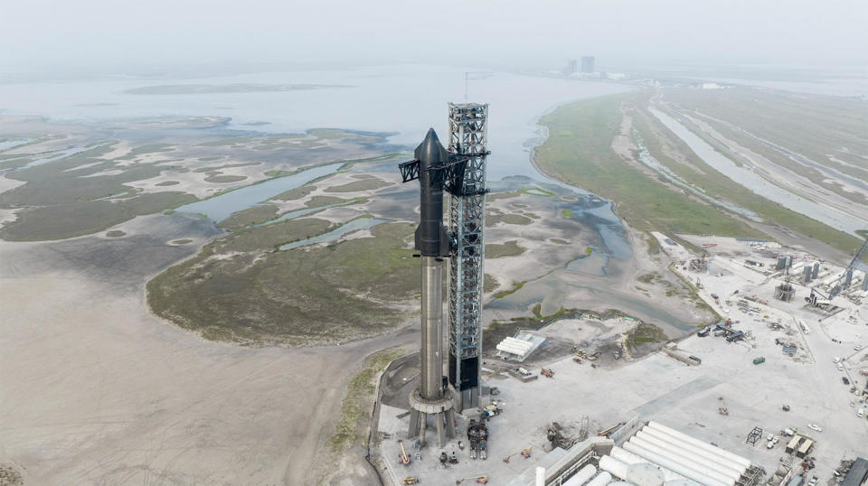 SpaceX's Super Heavy booster and Starship upper stage on the launch pad at the company's Boca Chica, Texas, launch site. With an FAA launch license in hand, SpaceX says launch is expected as early as Monday during a window opening at 8 a.m. EDT. / Credit: SpaceX