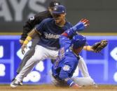 Jun 11, 2018; Milwaukee, WI, USA; Chicago Cubs second baseman Javier Baez (9) steals second base before the tag by Milwaukee Brewers shortstop Orlando Arcia (3) in the fifth inning at Miller Park. Mandatory Credit: Benny Sieu-USA TODAY Sports