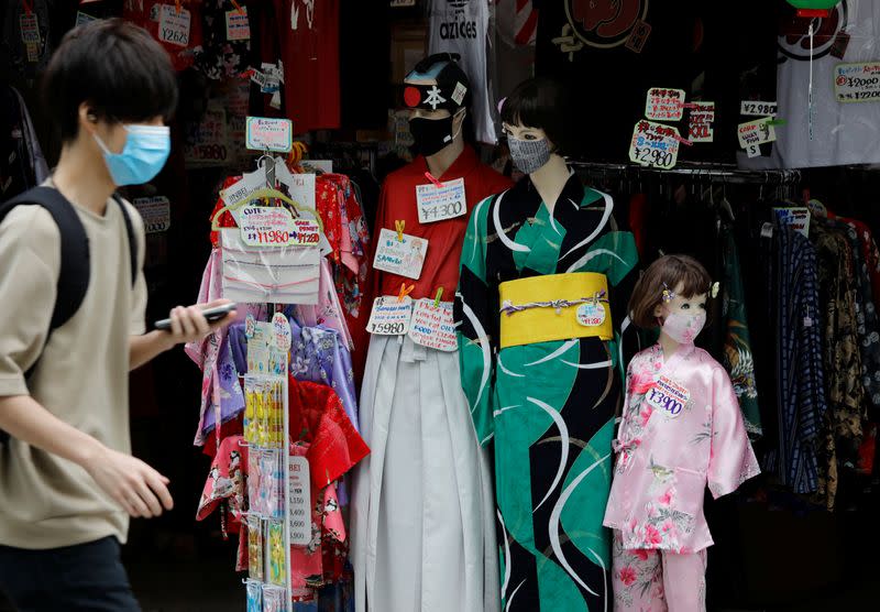 Mannequins in Japanese traditional costumes and wearing protective face masks are displayed at a souvenir shop at Asakusa district amid the coronavirus disease (COVID-19) outbreak in Tokyo