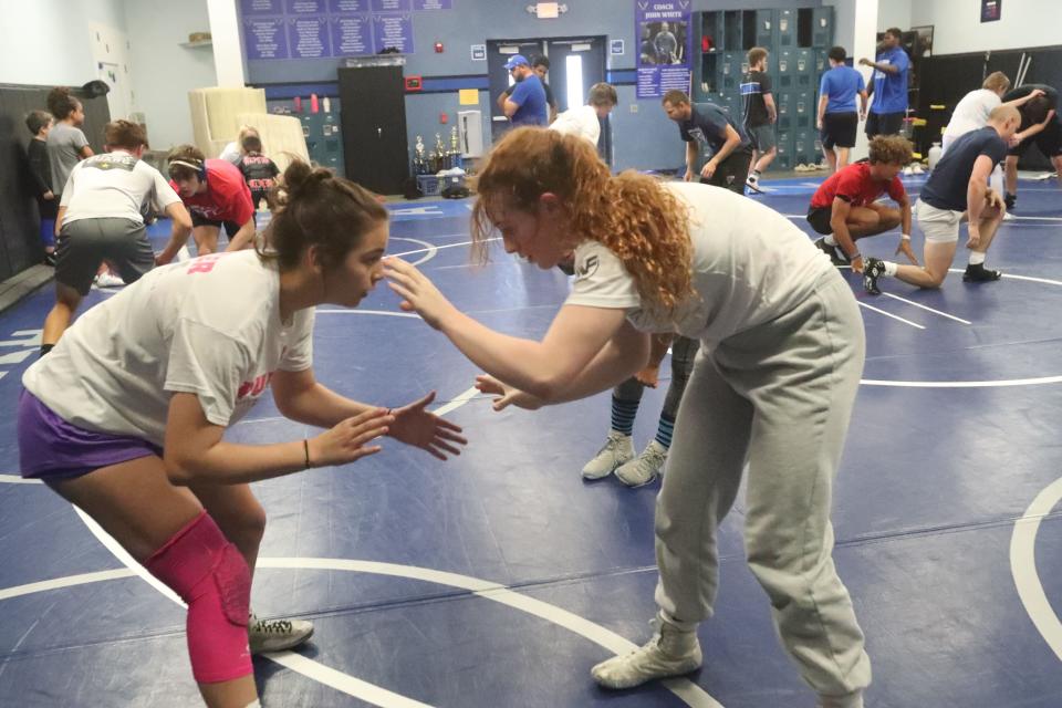 Matanzas wrestlers Tiana Fries (left) and Kendall Bibla try to gain an advantage, Tuesday, Nov. 21, 2023 during practice.
