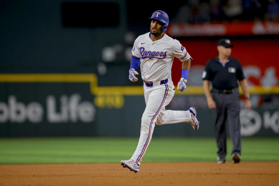 Texas Rangers' Marcus Semien jogs the bases after hitting a home run off Detroit Tigers starting pitcher Tarik Skubal during the first inning of a baseball game, Monday, June 3, 2024, in Arlington, Texas. (AP Photo/Gareth Patterson)