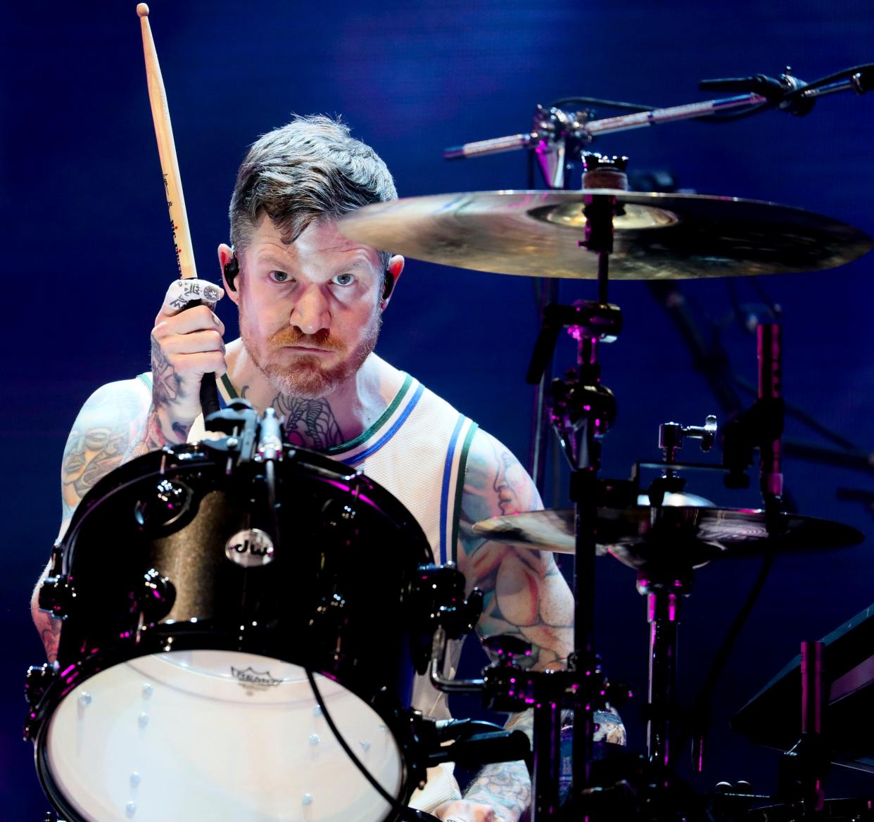 Fall Out Boy drummer Andy Hurley, who's from Menomonee Falls, wears a Giannis Antetokounmpo jersey while performing at the American Family Insurance Amphitheater in 2021. Fall Out Boy will headline Fiserv Forum on April 2.