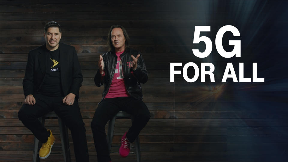 Sprint CEO Marcelo Claure and T-Mobile CEO John Legere sitting on stools