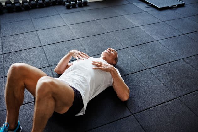 Start out doing a Dead Bug by lying flat on the floor with your knees bent.