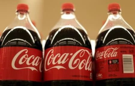 Bottles of Coca-Cola are seen at the Safeway store in Wheaton, Maryland in this February 13, 2015 file photo. REUTERS/Gary Cameron/Files