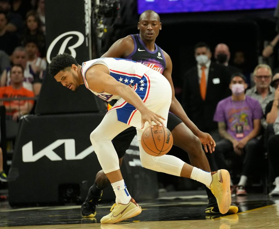 Mar 27, 2022; Phoenix, Arizona, United States;  Philadelphia 76ers forward Tobias Harris (12) loses the ball against Phoenix Suns center Bismack Biyombo (18) during the second quarter at Footprint Center.