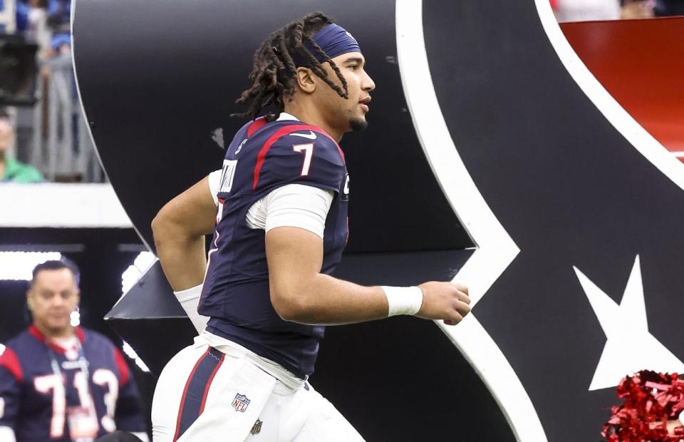 Dec 3, 2023; Houston, Texas, USA; Houston Texans quarterback C.J. Stroud (7) runs onto the field before the game against the Denver Broncos at NRG Stadium. Mandatory Credit: Troy Taormina-USA TODAY Sports