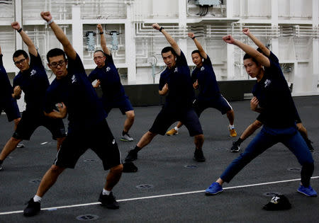 Crew members of Japanese helicopter carrier Kaga do navy exercises on the hangar deck at the Indian Ocean, Indonesia September 23, 2018. Picture taken on September 23, 2018. REUTERS/Kim Kyung-Hoon