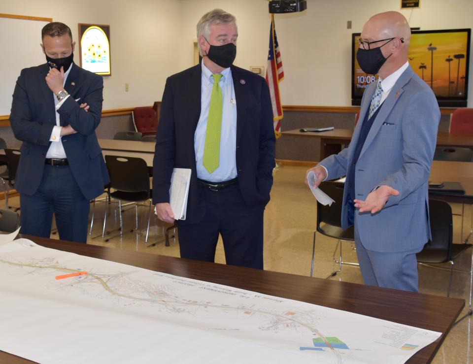 In this file photo circa 2021, Tim Smith, right, administrator of the Maryland State Highway Administration, speaks with U.S. Rep. David Trone,D-6th, center, as they look over a map of Interstate 81. At left is Gregory Slater, secretary of the Maryland Department of Transportation. The officials toured I-81.