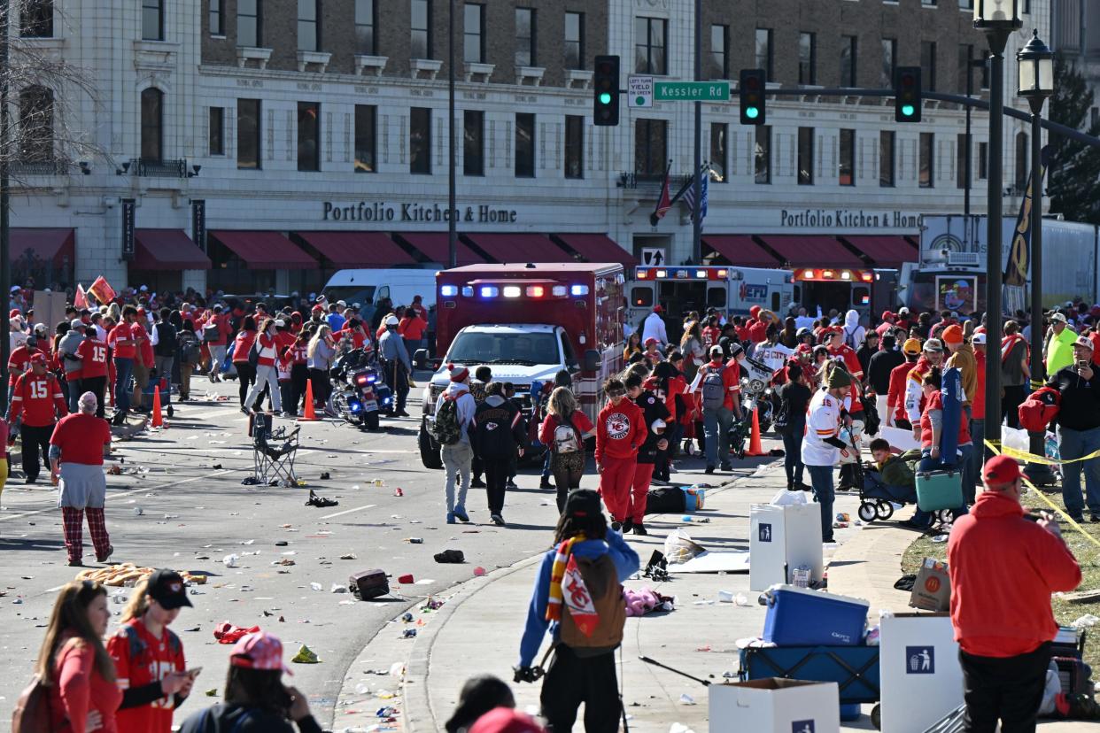 Fans leave the area after shots were fired after the celebration of the Kansas City Chiefs Super Bowl parade.