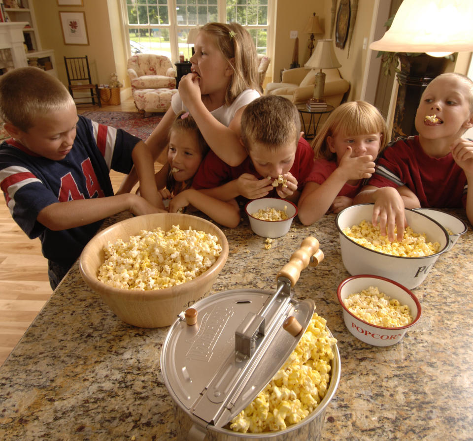 A group of children devour their popcorn in a promotional image used by Whirley Pop. (Photo: Courtesy of Dani Paluchniak)