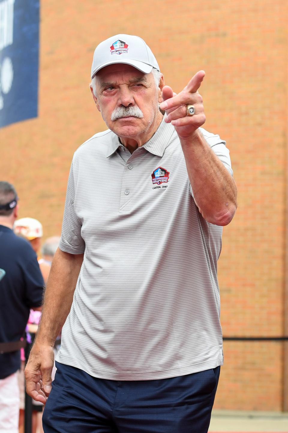 Hall of Fame fullback Larry Csonka celebrates with fans as he is introduced prior to the 2022 Pro Hall of Fame Enshrinement Ceremony at Tom Benson Hall of Fame Stadium on Aug. 6, 2022 in Canton, Ohio.