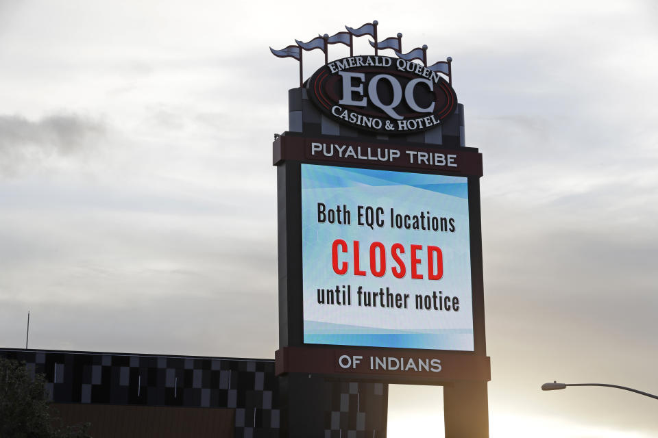 In this April 30, 2020 photo, a sign indicates that the new Emerald Queen Casino in Tacoma, Wash., which is owned by the Puyallup Tribe of Indians, is closed. Hundreds of tribal casinos across the country have voluntarily closed because of the coronavirus pandemic, in many cases taking away a tribe's primary source of revenue used to operate tribal government and social programs. (AP Photo/Ted S. Warren)