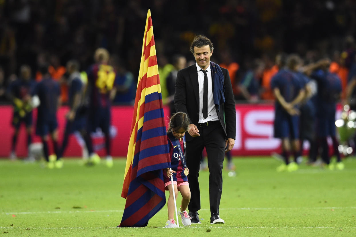 Football - FC Barcelona v Juventus - UEFA Champions League Final - Olympiastadion, Berlin, Germany - 6/6/15  Barcelona coach Luis Enrique celebrates with his daughter after winning the UEFA Champions League  Reuters / Dylan Martinez  