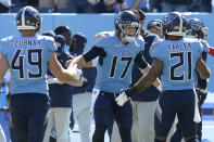 Tennessee Titans quarterback Ryan Tannehill (17) celebrates with defensive back Matthias Farley (21) in the final moments of the fourth quarter during the Titans 25-16 win over the Indianapolis Colts in an NFL football game Sunday, Sept. 26, 2021, in Nashville, Tenn. (AP Photo/Mark Zaleski)