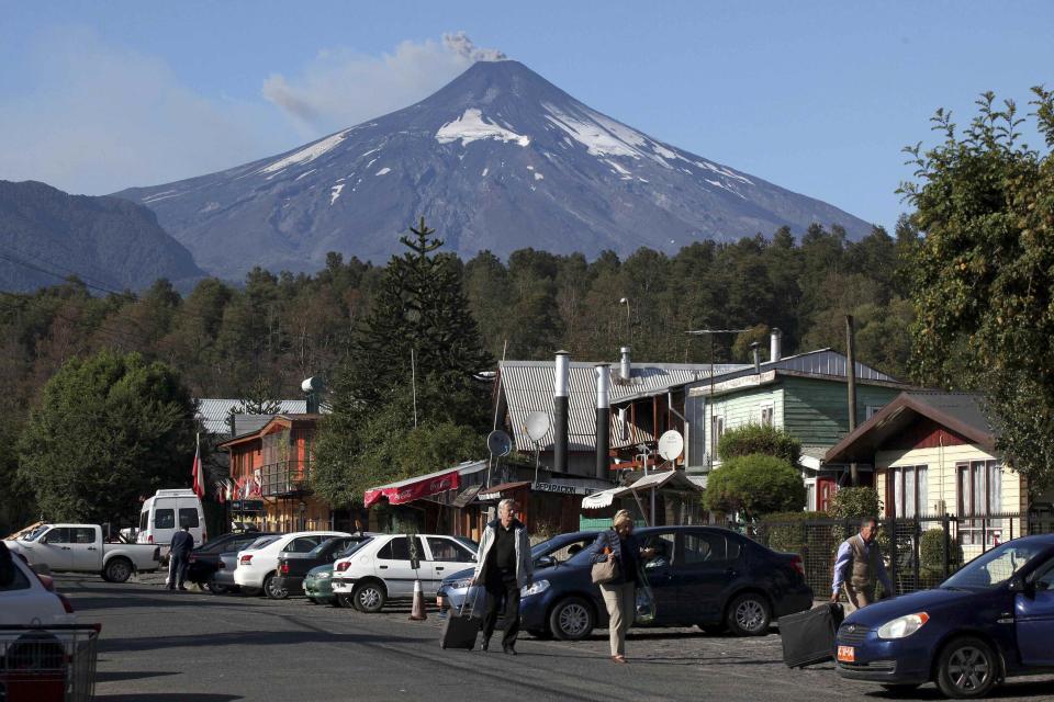 Smoke and ash rises from the Villarrica volcano as seen from Pucon town south of Santiago