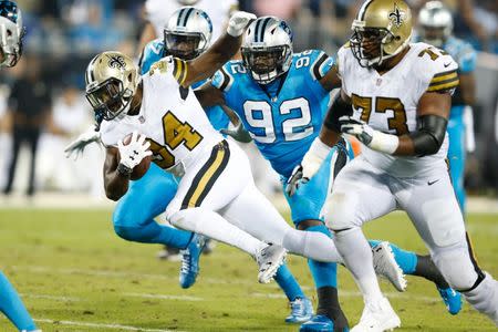 Nov 17, 2016; Charlotte, NC, USA; New Orleans Saints running back Tim Hightower (34) runs the ball during the third quarter against the Carolina Panthers at Bank of America Stadium. The Panthers defeated the Saints 23-20. Mandatory Credit: Jeremy Brevard-USA TODAY Sports