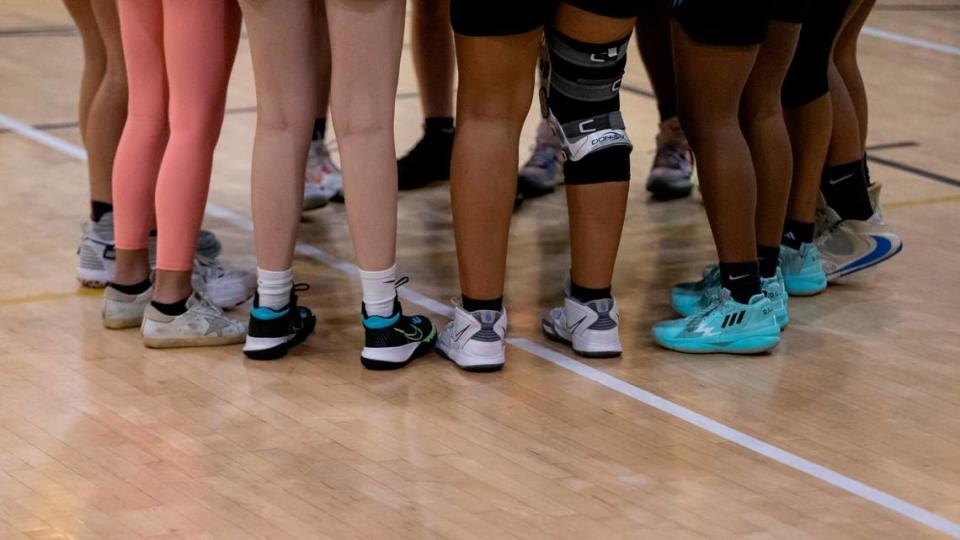 The Miami Palmetto Senior High School Lady Panthers huddle before the start of their basketball game against the Miami Senior High School Lady Stings at Miami Senior High School on Friday, Feb. 3, 2023.